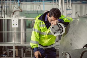 Tired Fatigue Exhaustion Engineer Worker Hard Working In Factory